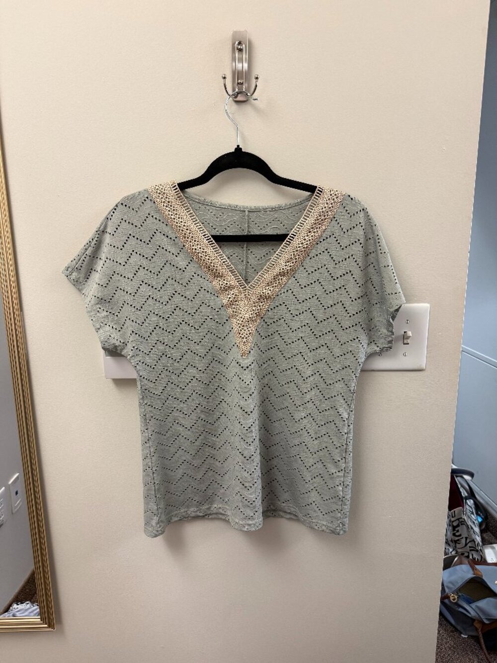 green blouse with cream lace